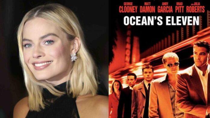 Margot Robbie junto al cartel de Ocean’s Eleven, película cuya precuela ha perdido a su director